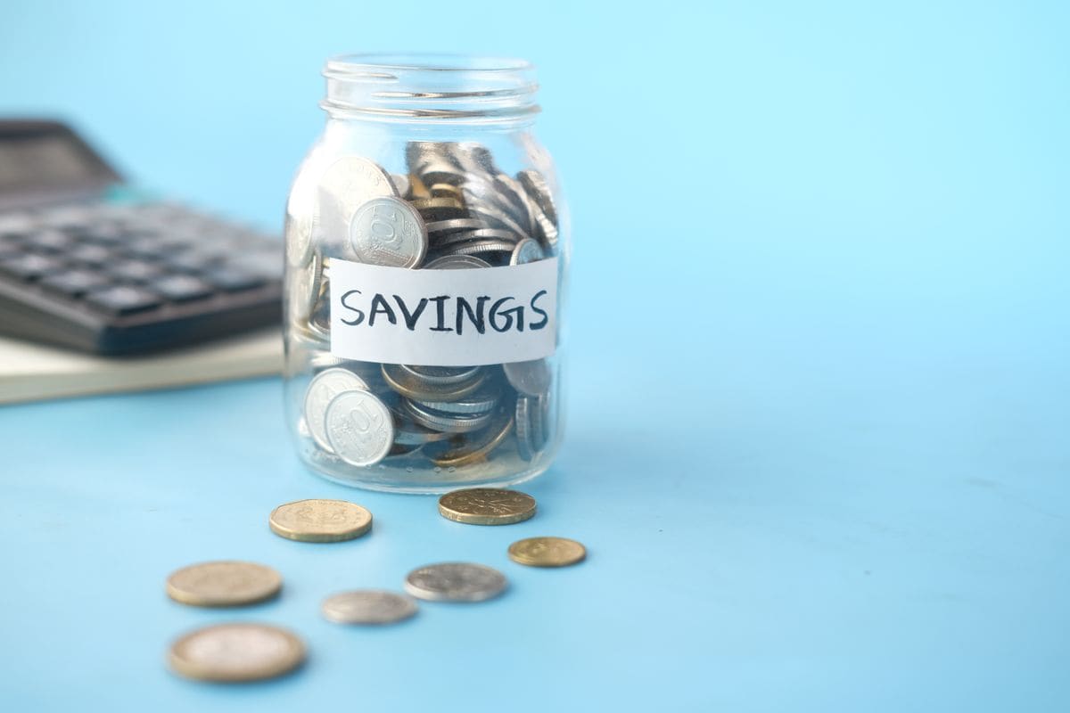 Glass jar of coins, like money kept in a separate account