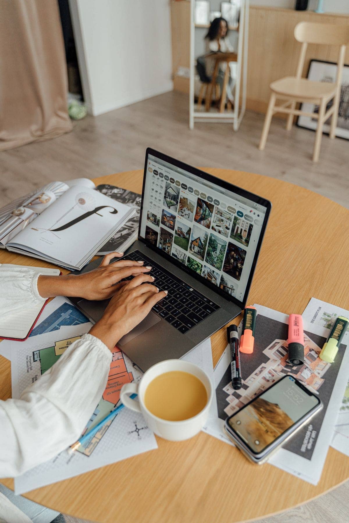 Person working from home with a laptop and coffee